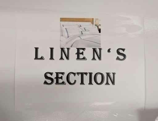 hotel storage room sign that says 'linens section'